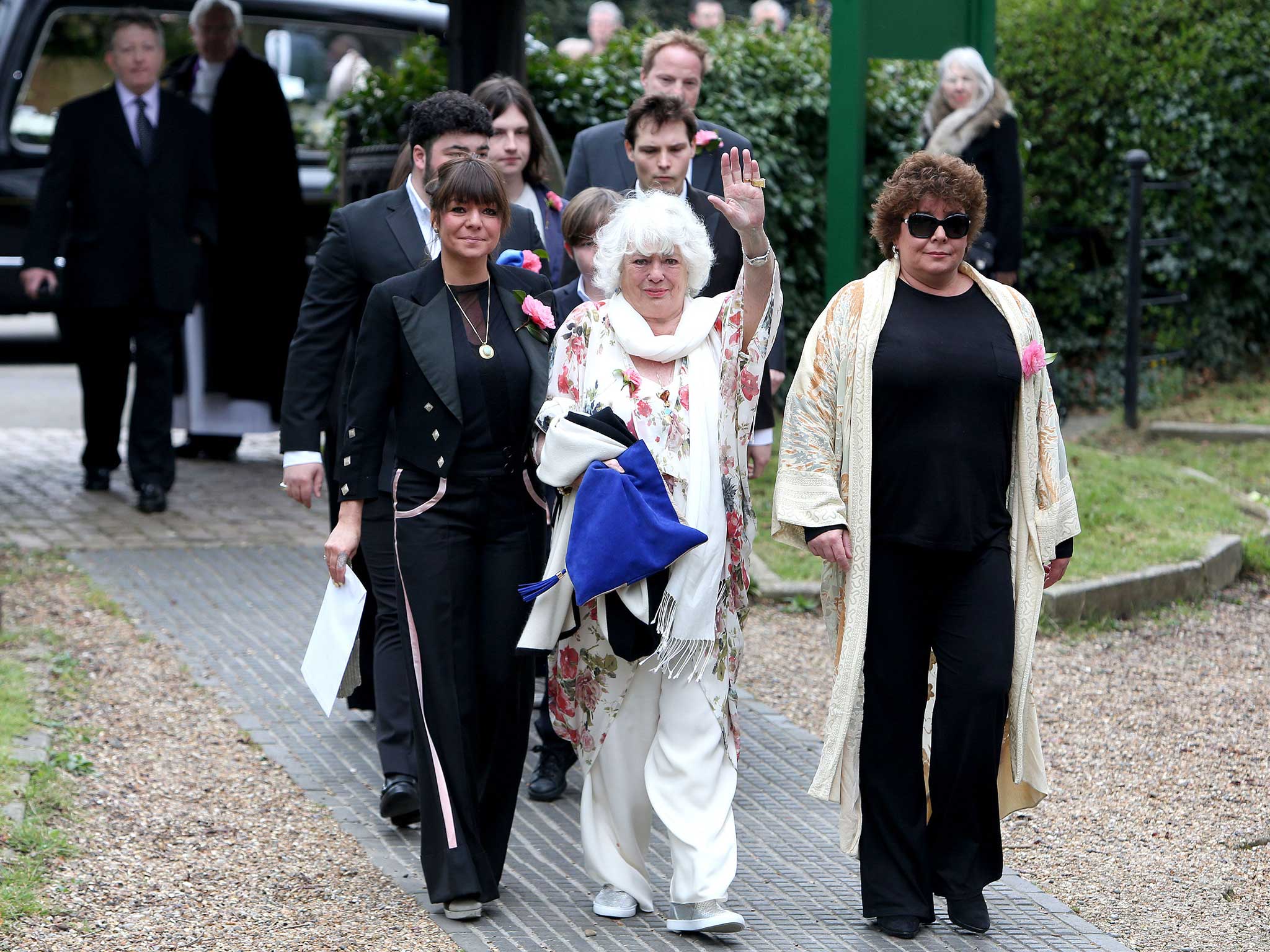 Ronnie Corbett's wife Anne Hart (centre) arrives with their daughters, Sophie (left) and Emma, for his funeral service (Press Association )