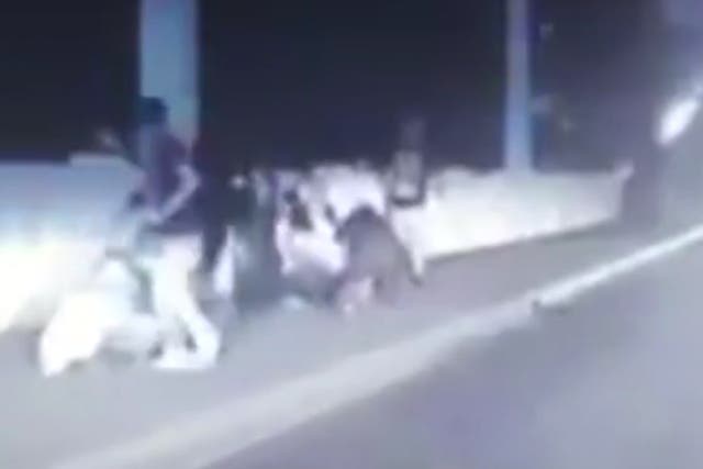 Video captures moment police officer stops woman jumping off bridge