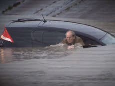 Read more

Texas floods: Reporter jumps in water to help man submerged in his car