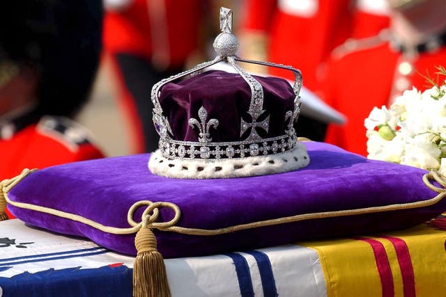 <p>The Queen Mother's crown on her coffin during a ceremonial procession on 5 April 2002. The Koh-i-Noor diamond is the centre-piece of the crown, which will one day be worn by the Duchess of Cornwall </p>