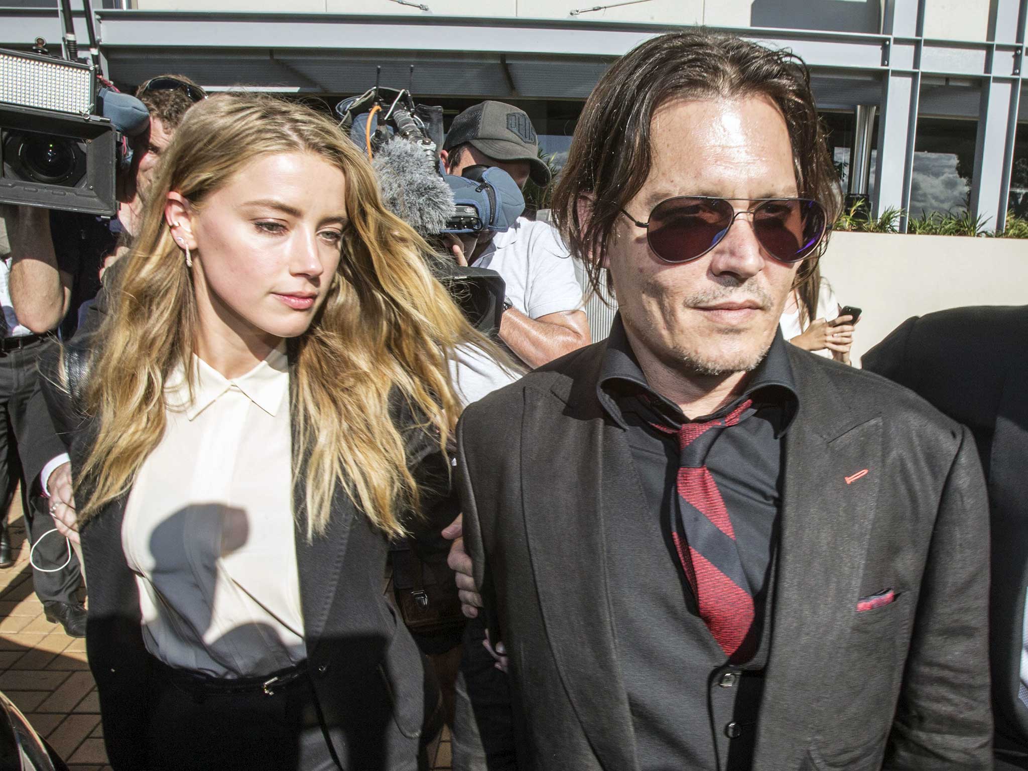 Johnny Depp and his estranged wife Amber Heard, who has filed for divorce and accused him of domestic abuse