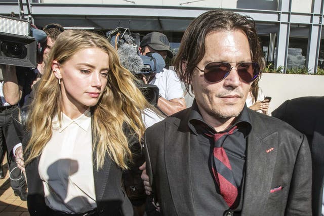 Johnny Depp and wife Amber Heard arrive at the Southport Magistrates Court on Australia's Gold Coast. Depp's wife Amber Heard, appeared in the Queensland court charged with illegally smuggling the couple's Yorkshire terriers, Pistol and Boo, into the country on a private jet while Depp was shooting a Pirates of the Caribbean movie last year