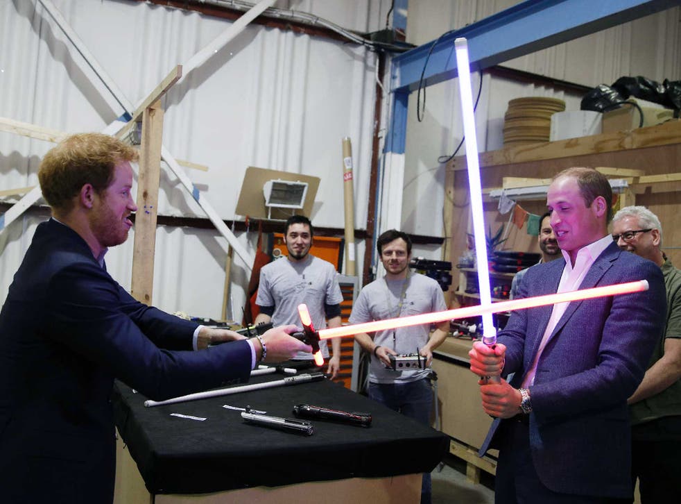 Prince Harry and Prince William try out light sabres during a tour of the Star Wars sets at Pinewood studios in Iver Heath, west of London. Prince William and Prince Harry are touring Pinewood to visit the production workshops and meet the creative teams working behind the scenes on the Star Wars films