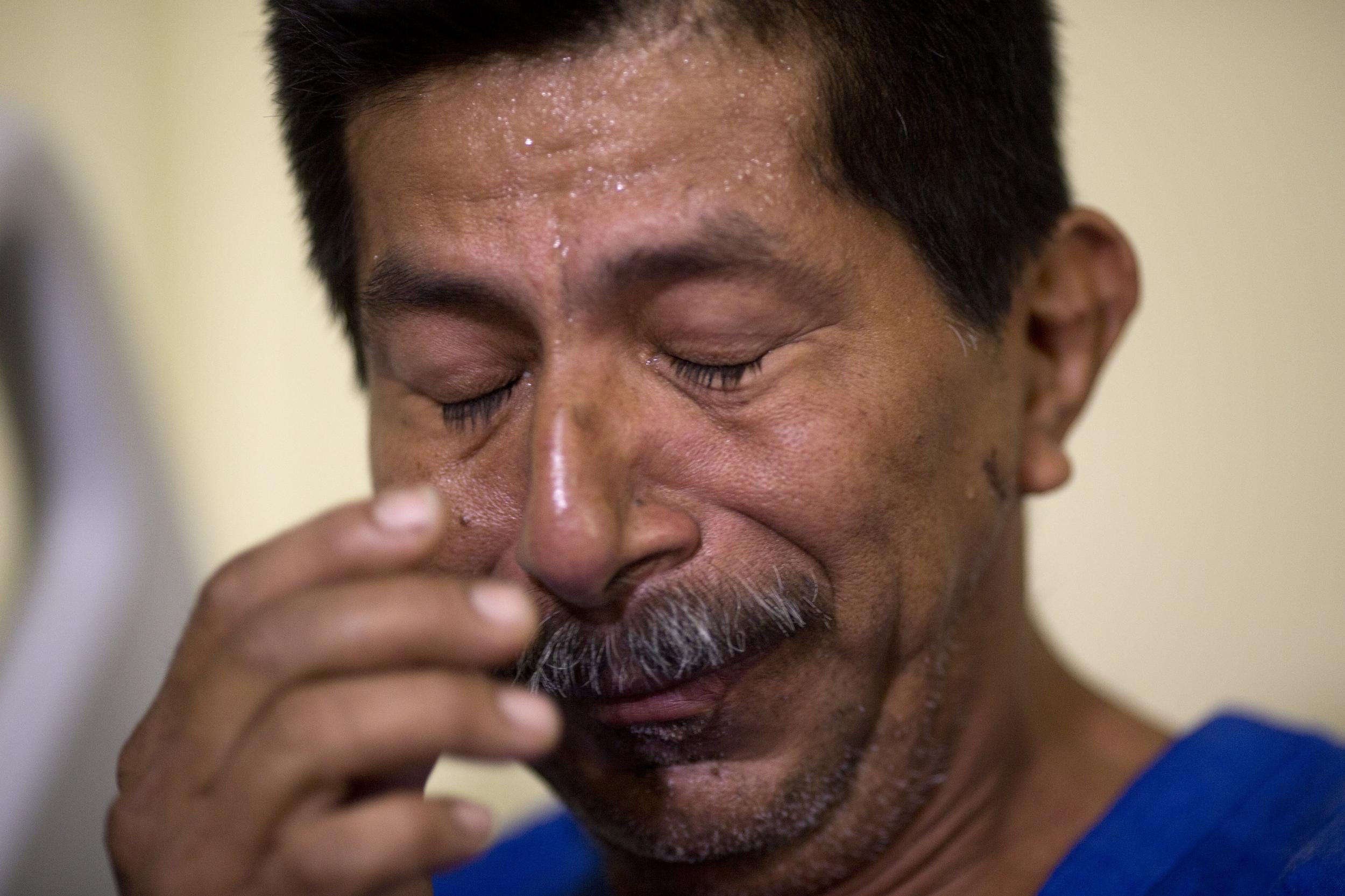 Earthquake survivor Pablo Rafael Cordova Canizares cries as he rests at the Verdi Cevallos Balda hospital