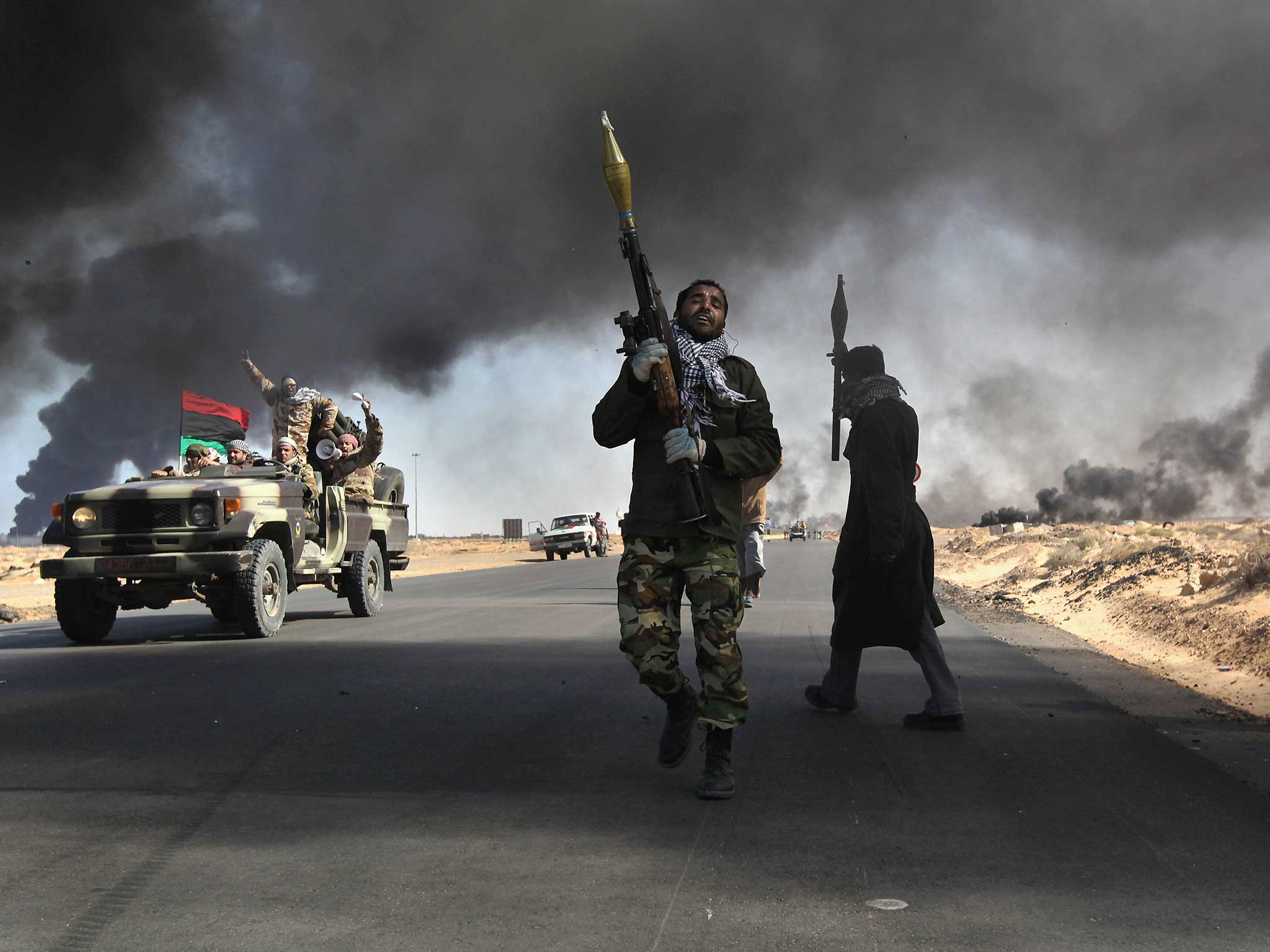 Rebels battle government troops in Ra’s Lanuf, 2011 (Getty)