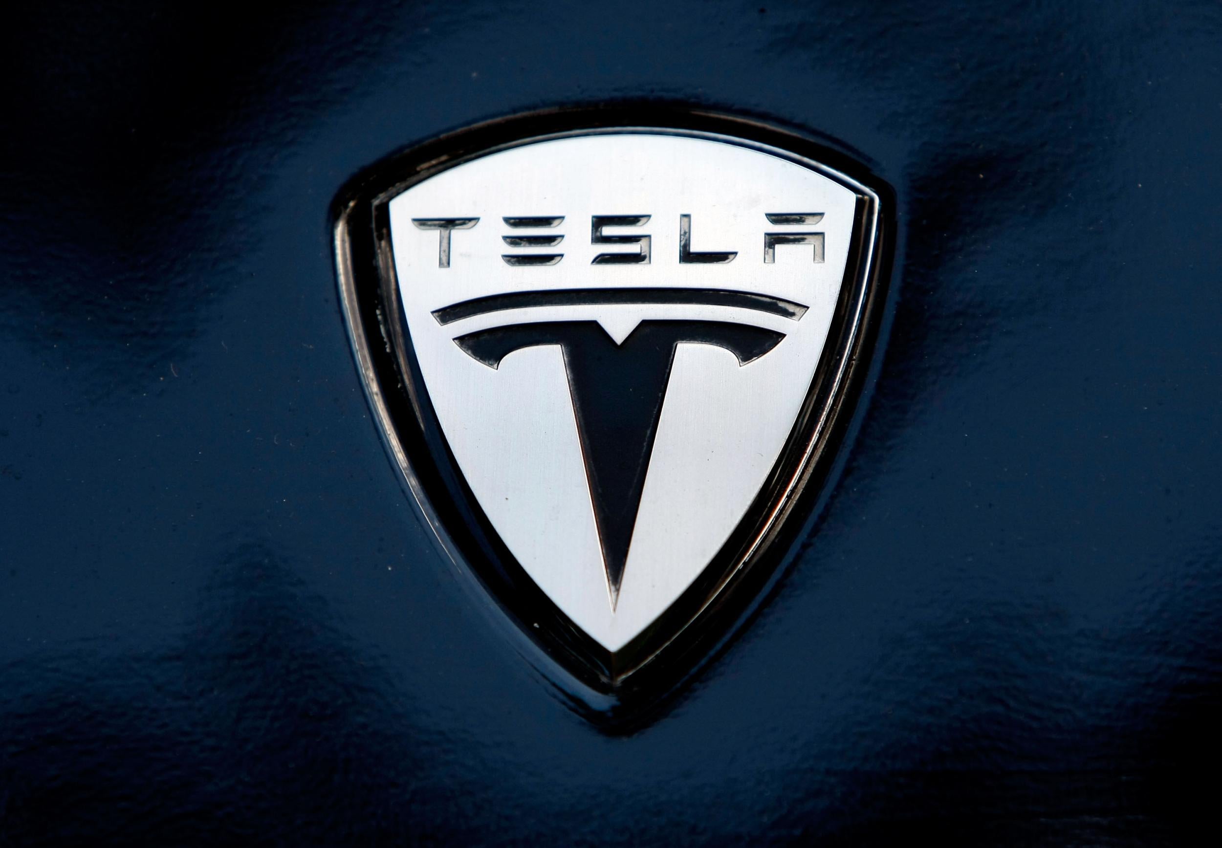 The Tesla logo on the bonnet of one of the company's electric cars