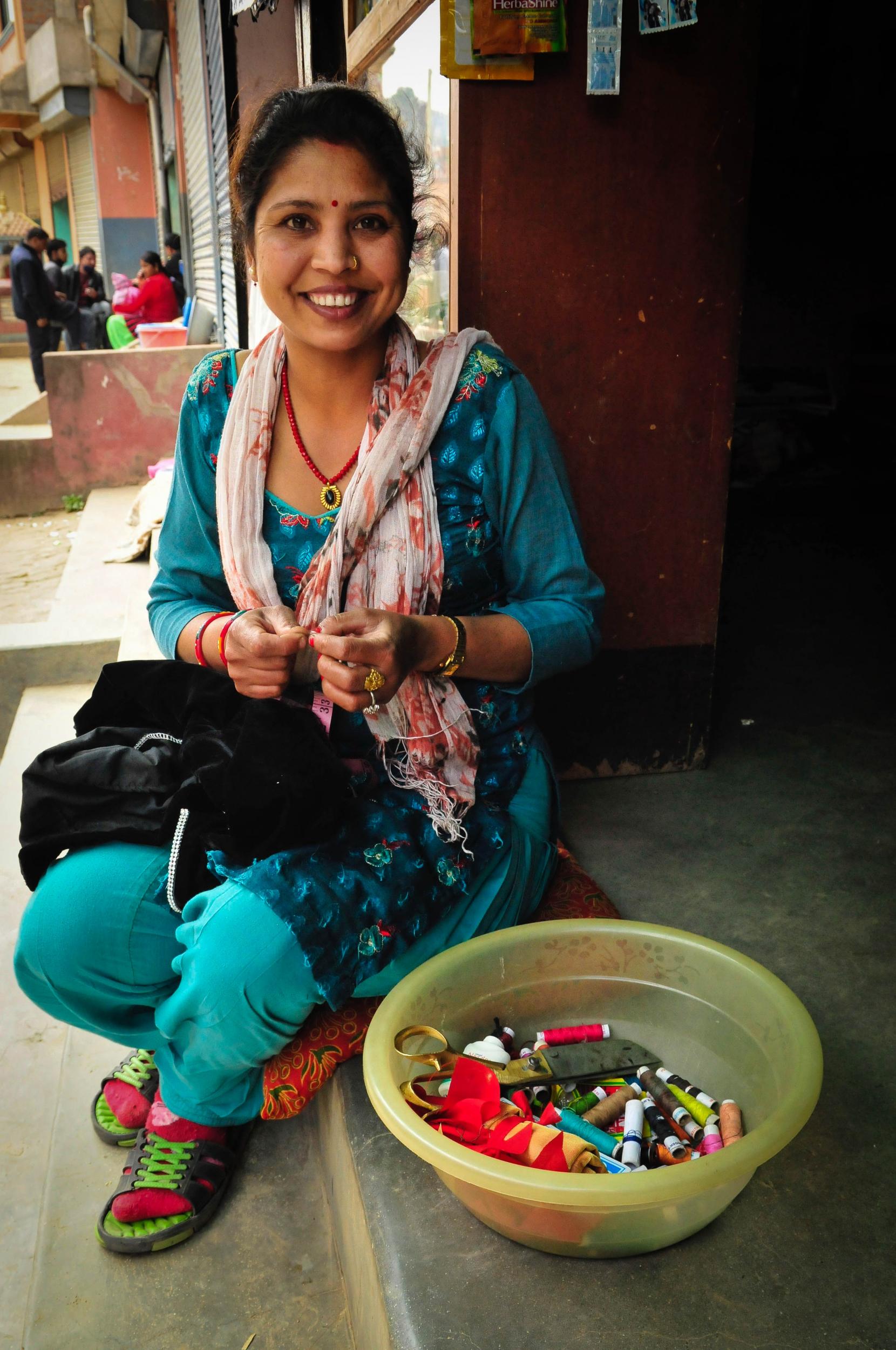 Ambika making the sari top (Emma Thomson )