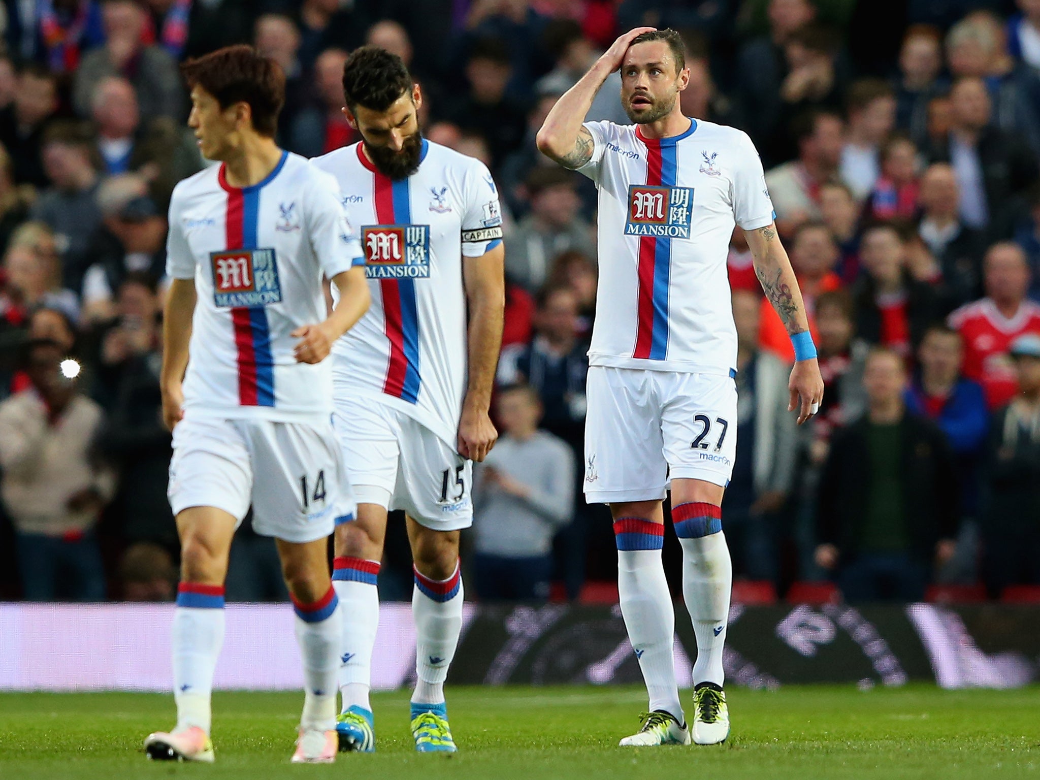 Damien Delaney, right, reacts after scoring an own goal