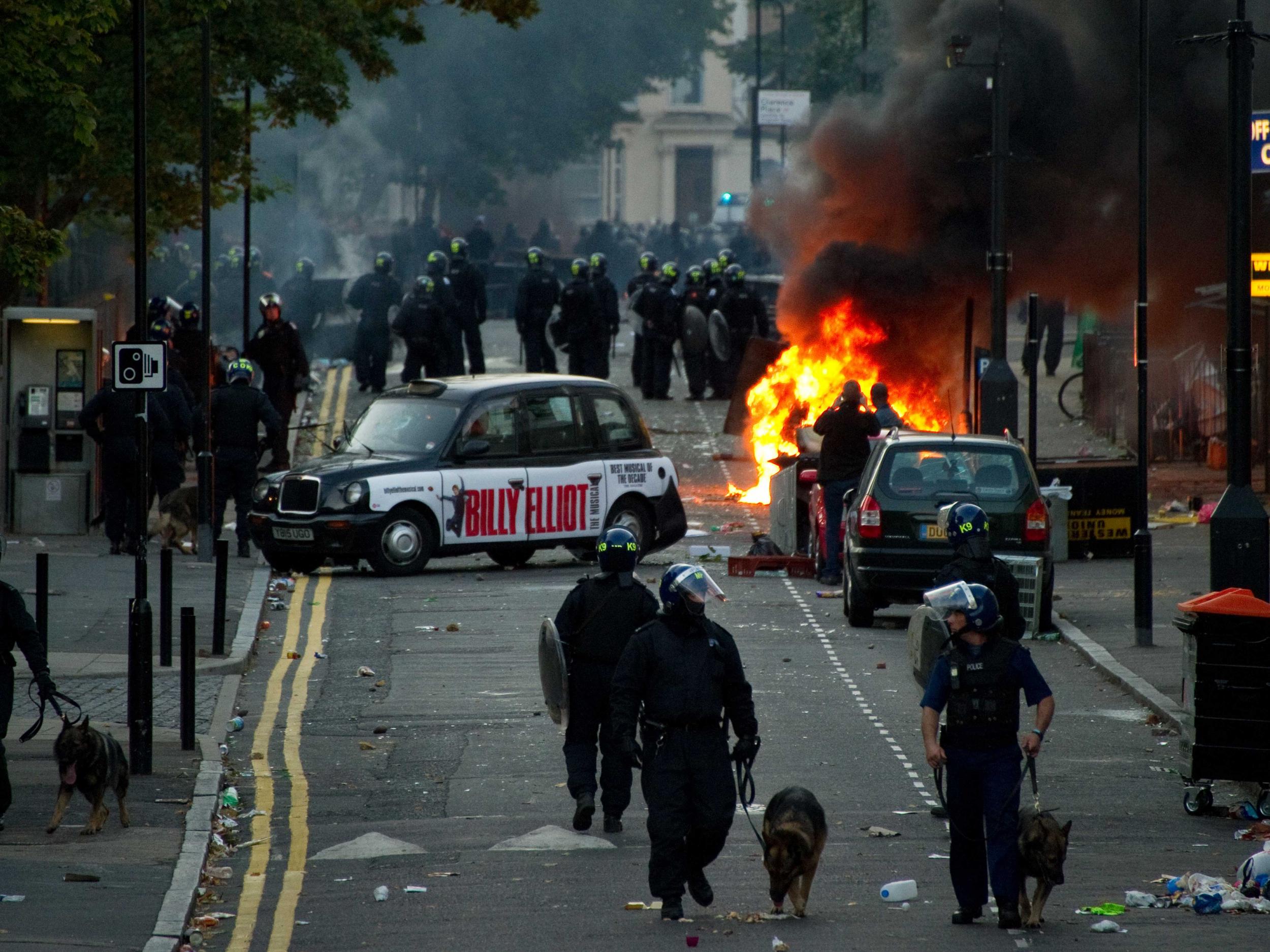 Police charge rioters in Hackney, east London, during the 2011 disturbances