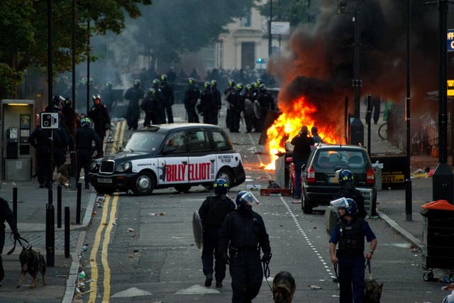 Police charge rioters in Hackney, east London, during the 2011 disturbances