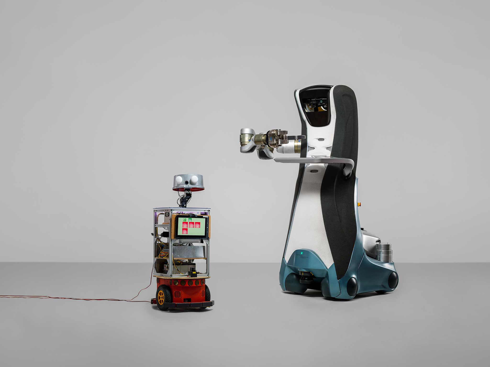 Care-O-bot (right) can respond to spoken commands and speak themselves