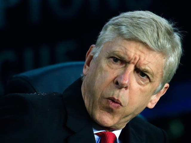Arsenal manager Arsene Wenger reacts in his dugout