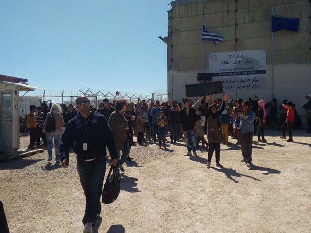 Refugees at the Vial detention centre celebrate as they finally get to leave