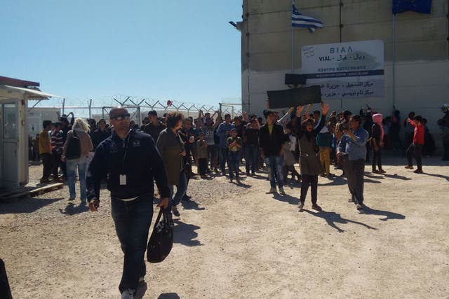 Refugees at the Vial detention centre celebrate as they finally get to leave