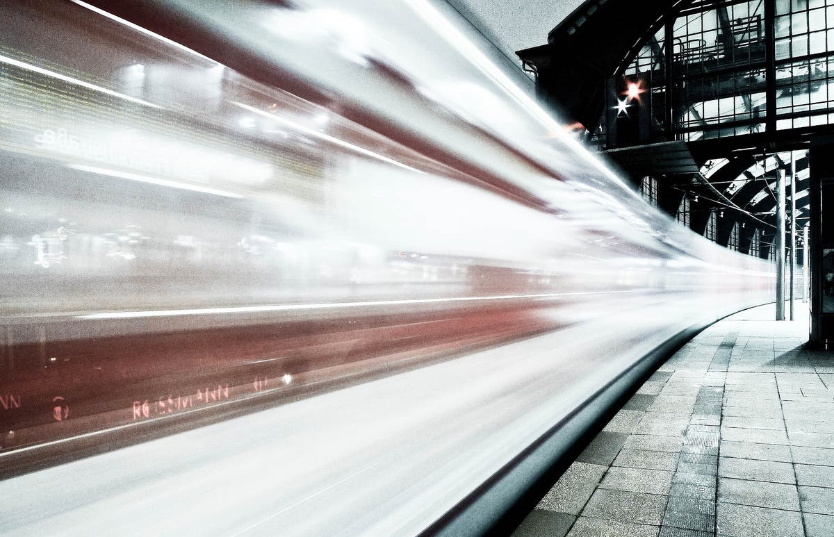 Train is leaving. City train track.