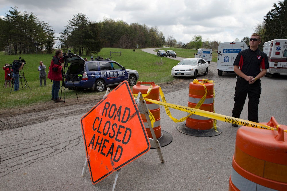 &#13;
Emergency and media personnel arrive at Union Hill Road. John Minchillo/Associated Press&#13;