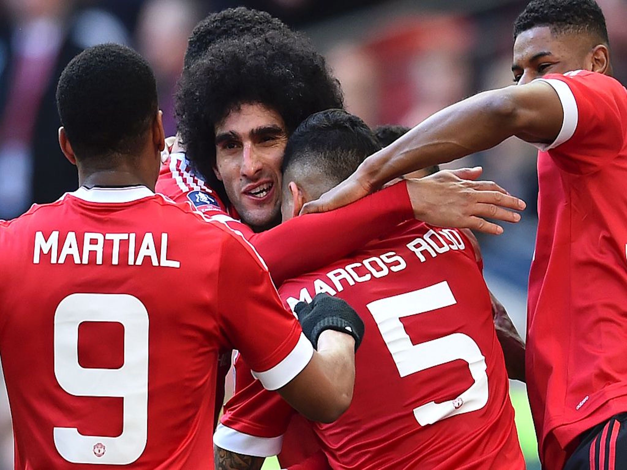 &#13;
Fellaini celebrates scoring for United against Everton in the FA Cup semi-final &#13;