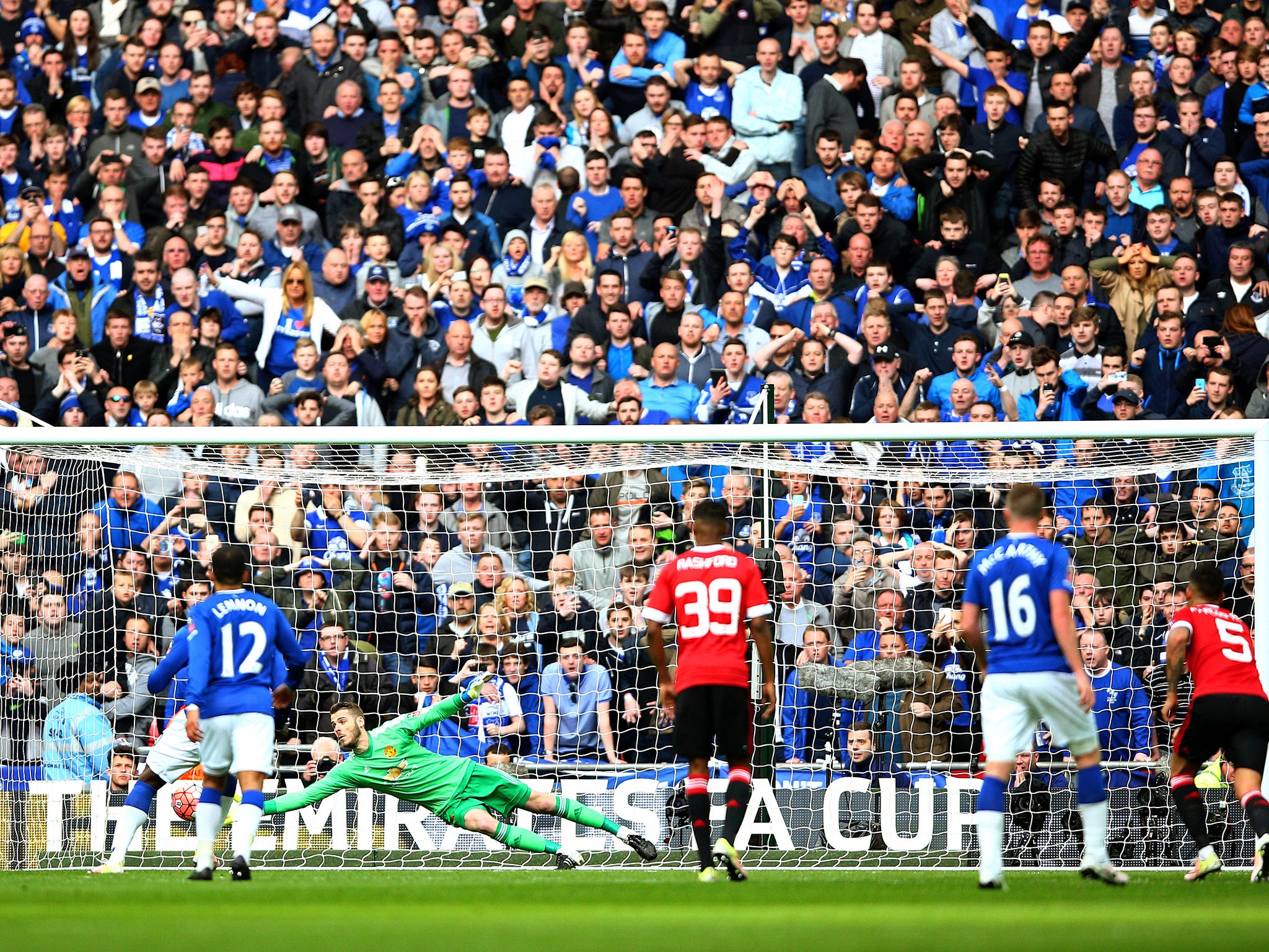 David De Gea dives down to save Romelu Lukaku's penalty