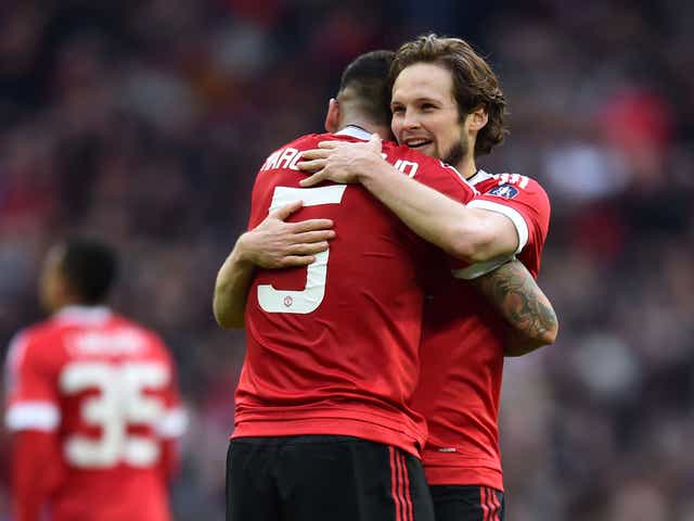 Daley Blind celebrates with Marcos Rojo after Manchester United's victory over Everton