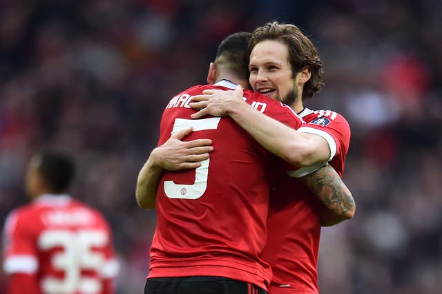 Daley Blind celebrates with Marcos Rojo after Manchester United's victory over Everton