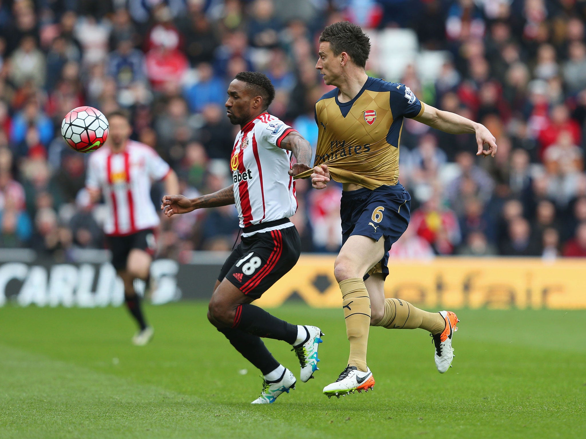 Jermain Defoe competes for the ball