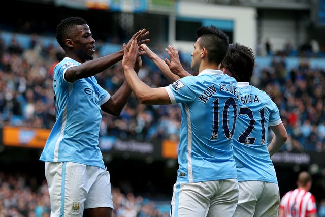 Sergio Aguero of Manchester City celebrates with team mates, David Silva and Kelechi Iheanacho