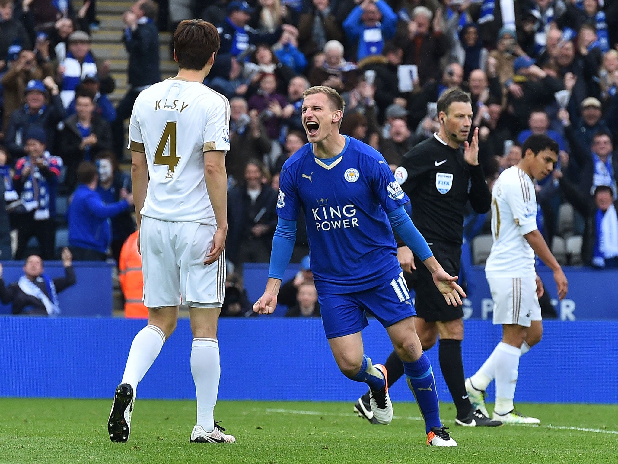 Marc Albrighton celebrates after putting the finishing touch on Leicester's win over Swansea