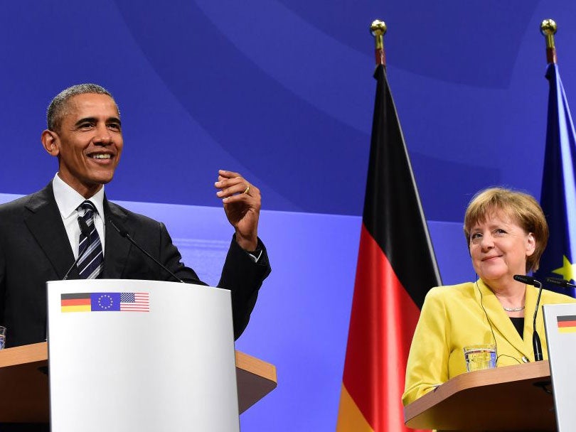 US President Barack Obama and German Chancellor Angela Merkel address a press conference after their bilateral talks at the Herrenhausen Palace in Hanover, on April 24, 2016.