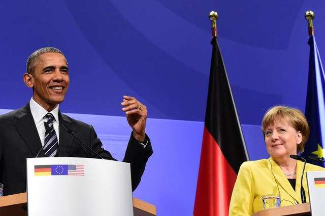 US President Barack Obama and German Chancellor Angela Merkel address a press conference after their bilateral talks at the Herrenhausen Palace in Hanover, on April 24, 2016.