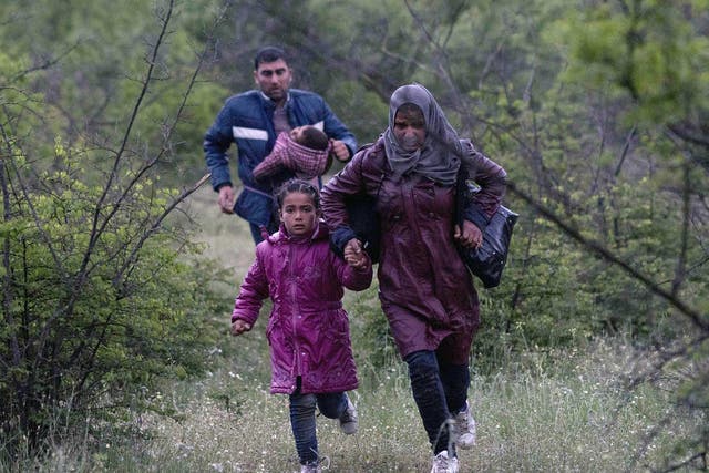 A Syrian family run in a forest in Macedonia after illegally crossing Greek-Macedonian border near the city of Gevgelija. Some 50,000 people, many of them fleeing the war in Syria, have been stranded in Greece since the closure of the migrant route through the Balkans in February