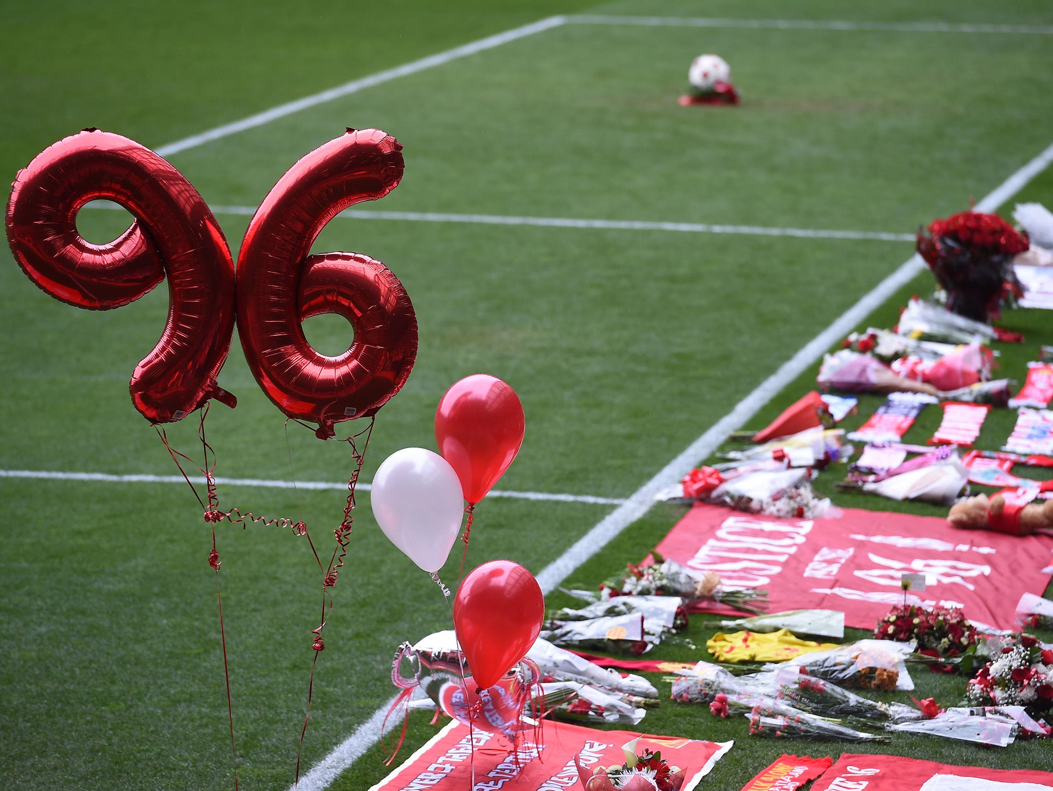Balloons make the number '96' during a memorial service at Anfield in Liverpool, north west England on April 15, 2016