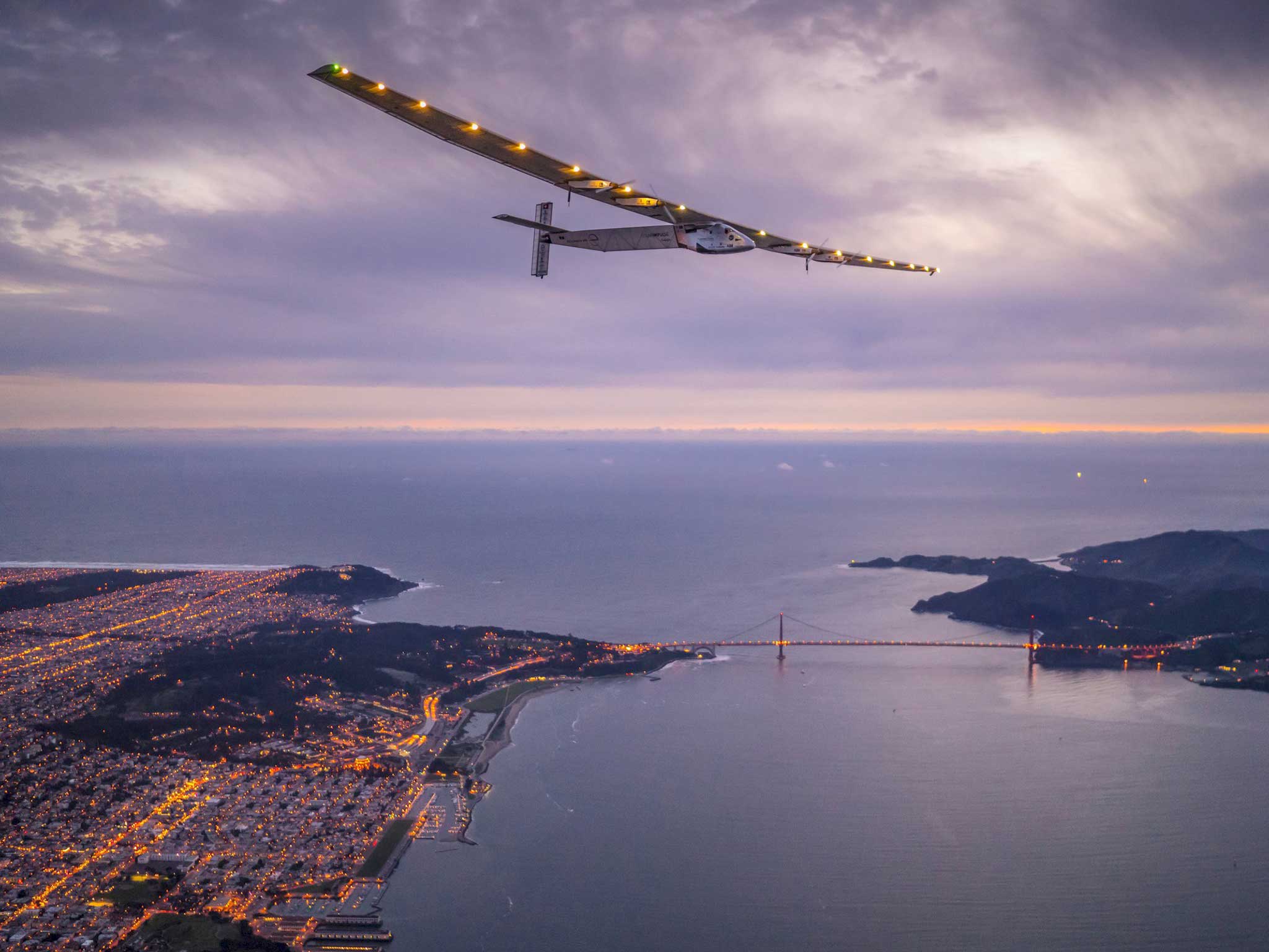 "Solar Impulse 2", a solar-powered plane piloted by Bertrand Piccard of Switzerland, flies over the Golden Gate bridge in San Francisco, before landing on Moffett Airfield following a 62-hour flight from Hawaii