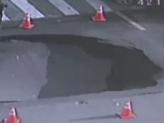 Huge sinkhole opens at busy Chinese intersection 