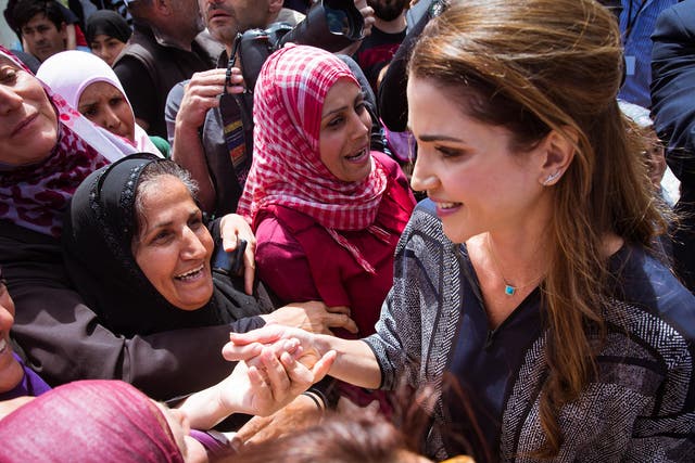Jordan's Queen Rania talks to refugees during her visit to Lesbos