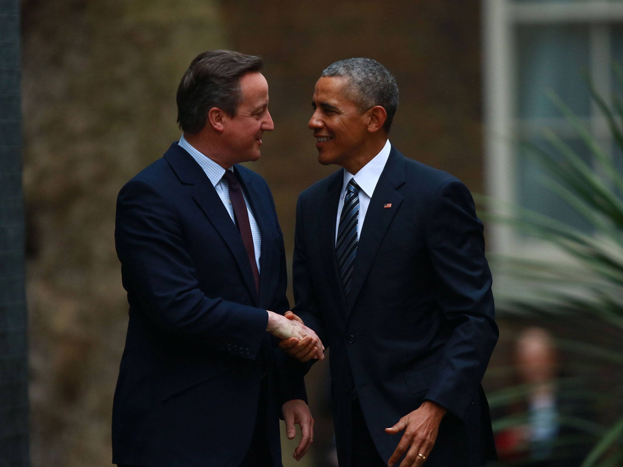 Prime Minister David Cameron greets President Obama during a visit to Britain
