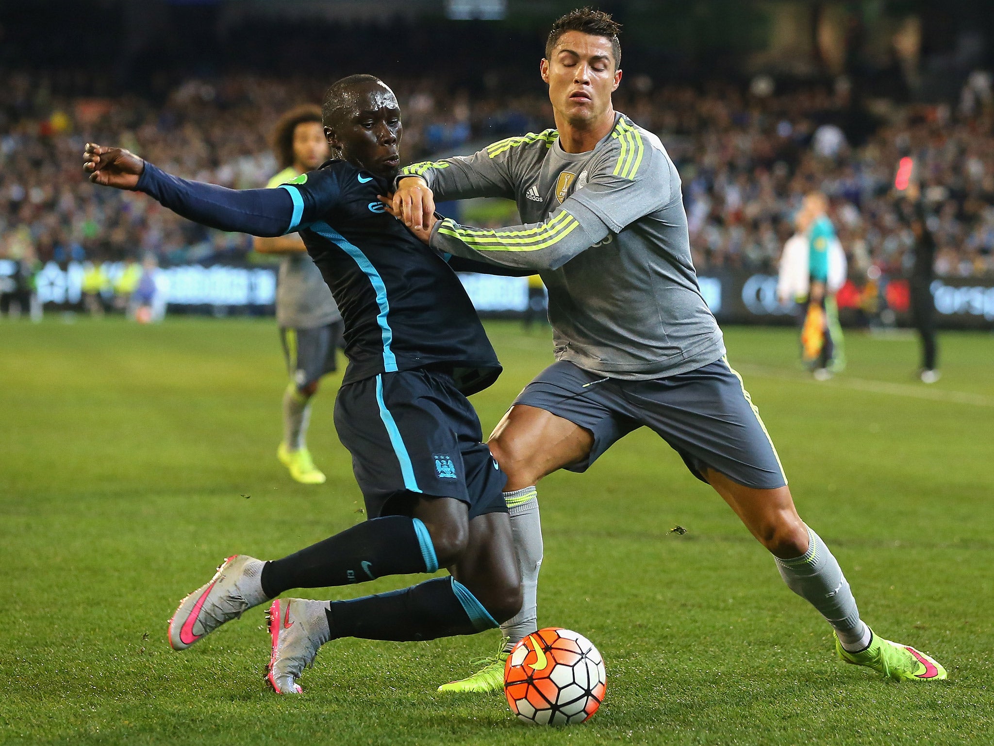 Cristiano Ronaldo is challenged by Bacary Sagna during Real Madrid's win over Manchester City in 2012