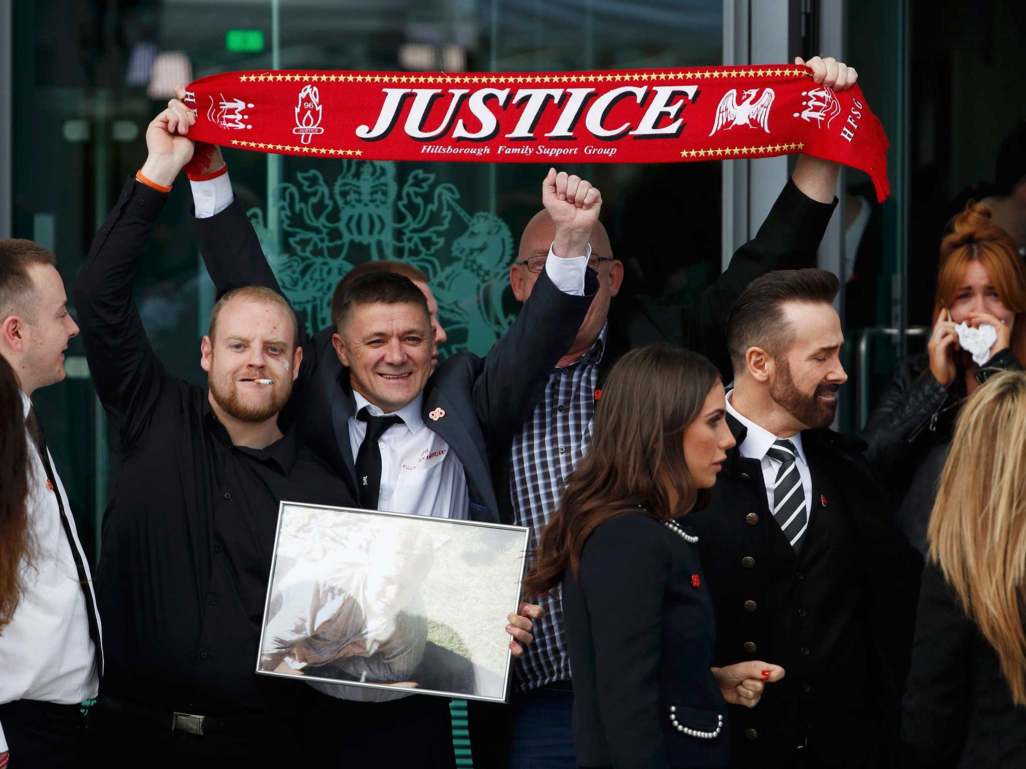 Relatives react after the jury delivered its verdict at the new inquests into the Hillsborough disaster, in Warrington