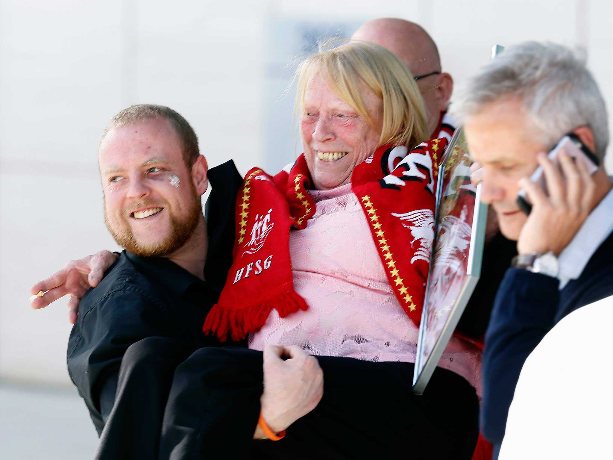 Relatives of those who died in the Hillsborough disaster celebrate outside the Hillsborough Inquest in Warrington