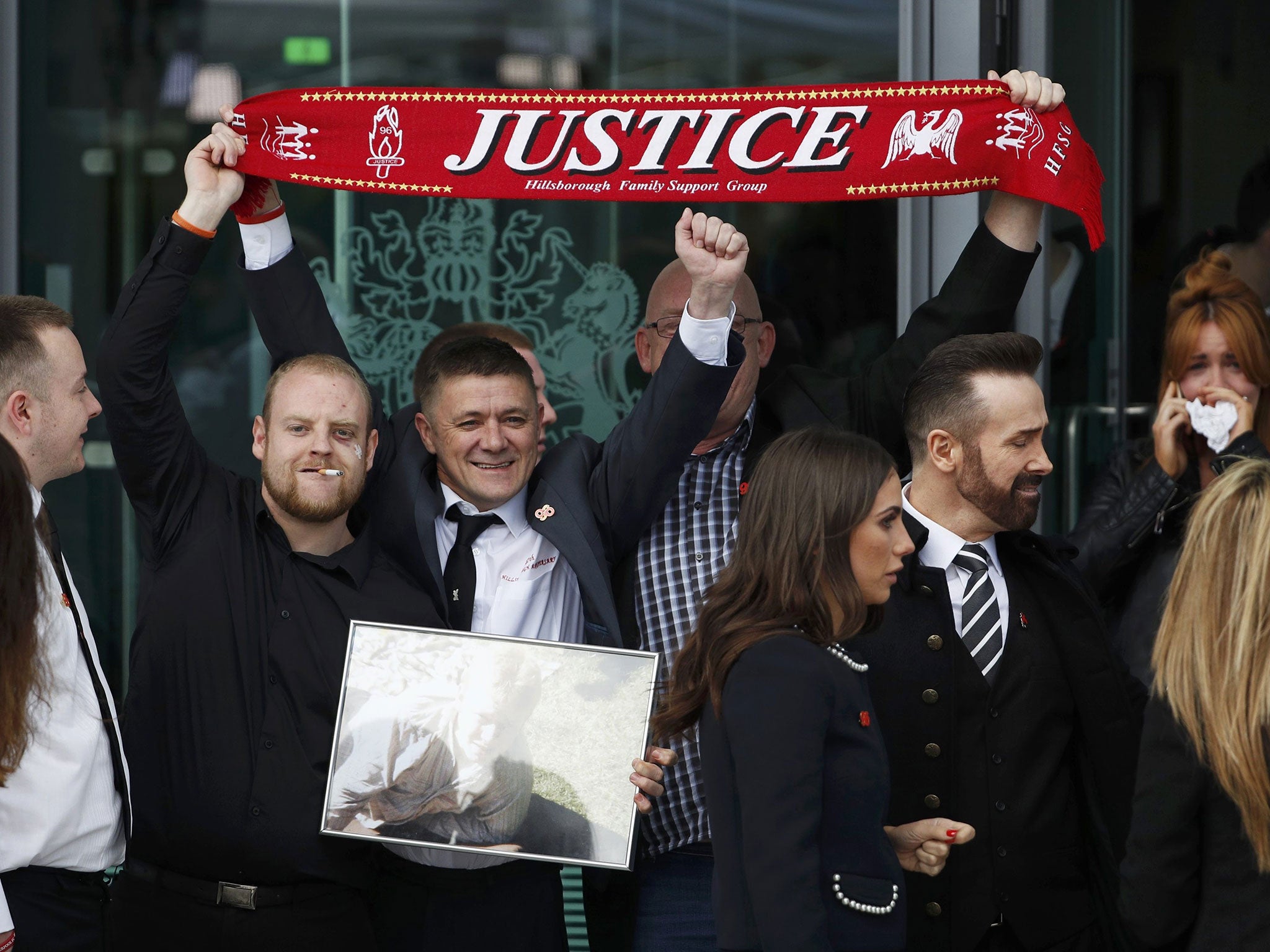 Relatives react after the jury delivered its verdict at the new inquests into the Hillsborough disaster, in Warrington, Britain April 26, 2016.