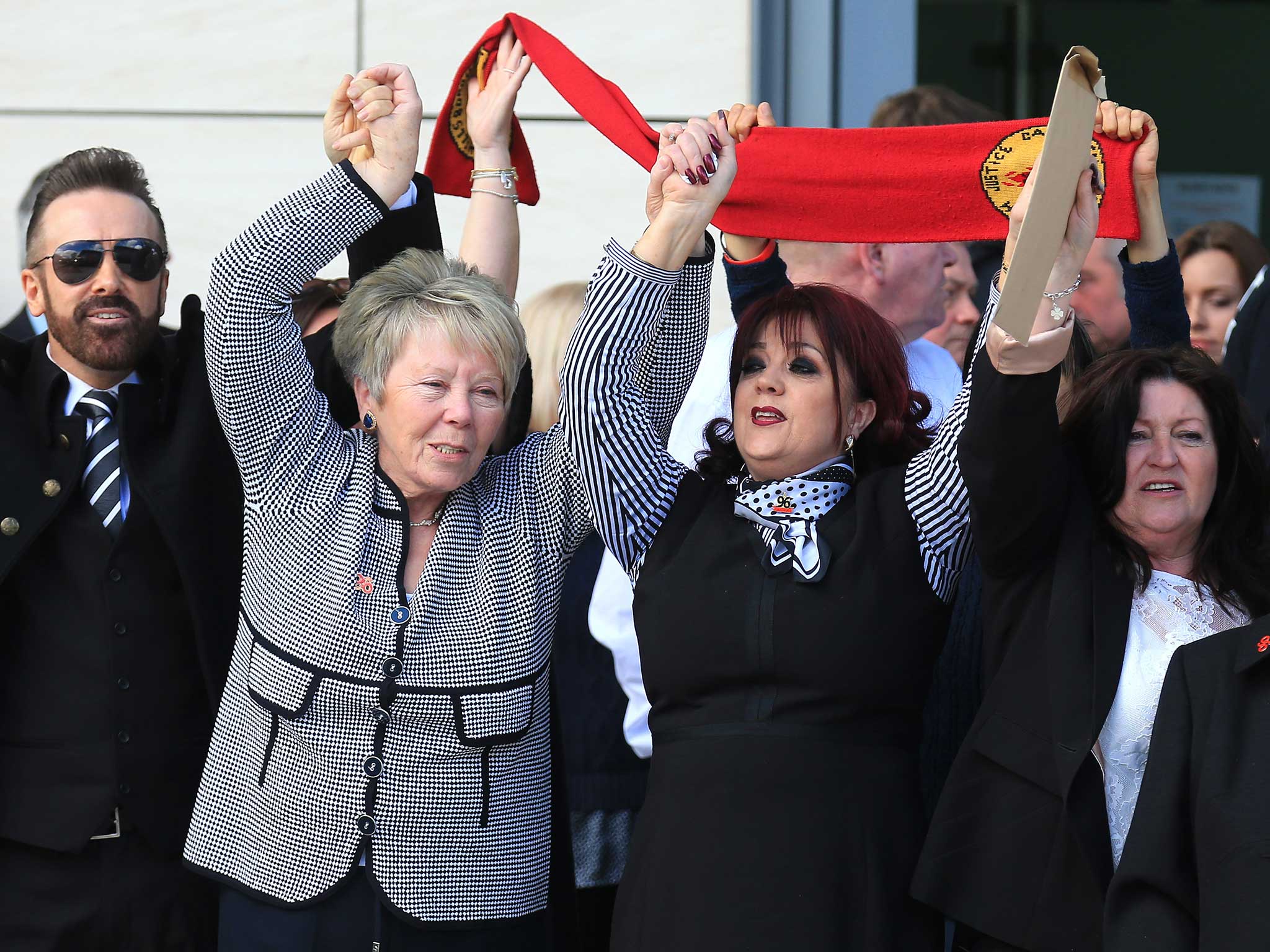 Relatives of the Hillsborough sing 'You'll never walk alone' as they depart Birchwood Park after hearing the conclusions of the Hillsborough inquest