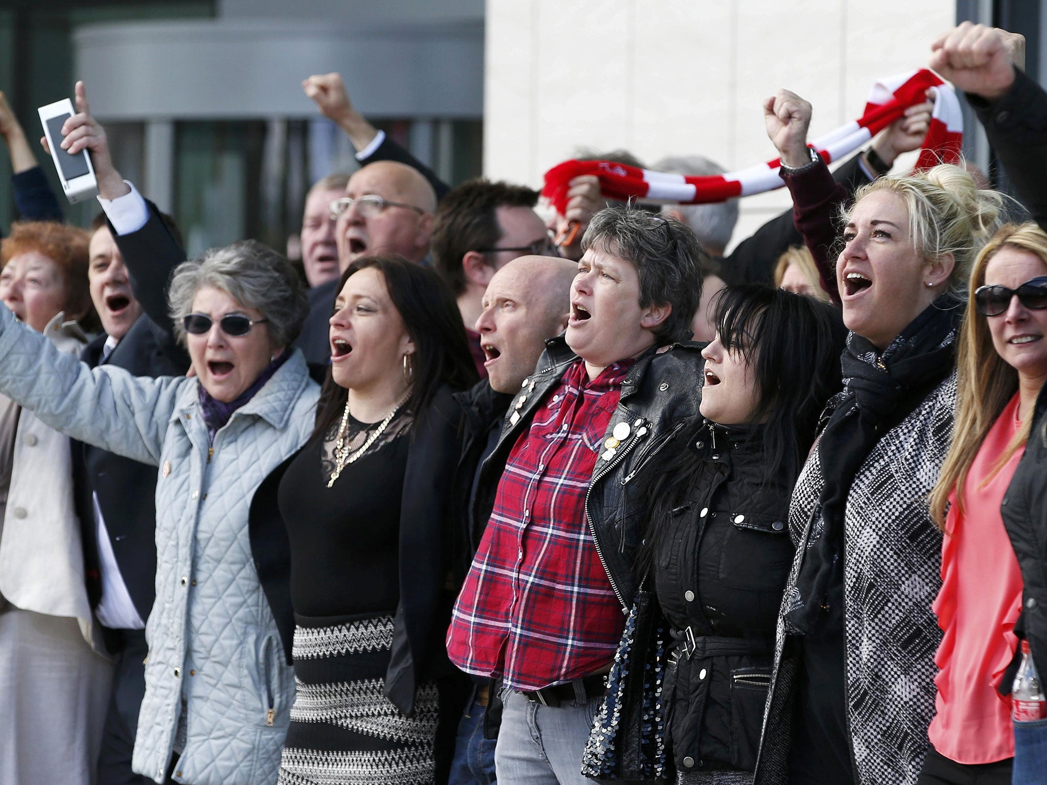 Relatives sing "You'll never walk alone" after the jury delivered its verdict at the new inquests into the Hillsborough disaster, in Warrington, Britain April 26, 2016.