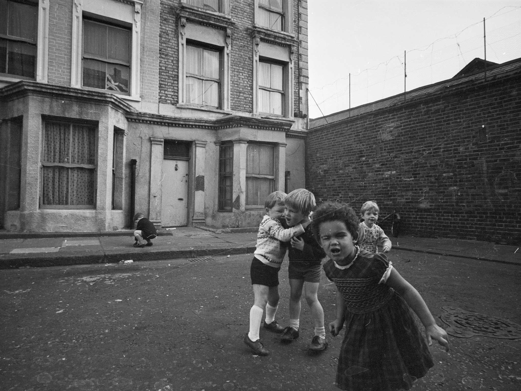 Children play outside 10 Rillington Place, once the home of mass murderer John Christie, in 1966