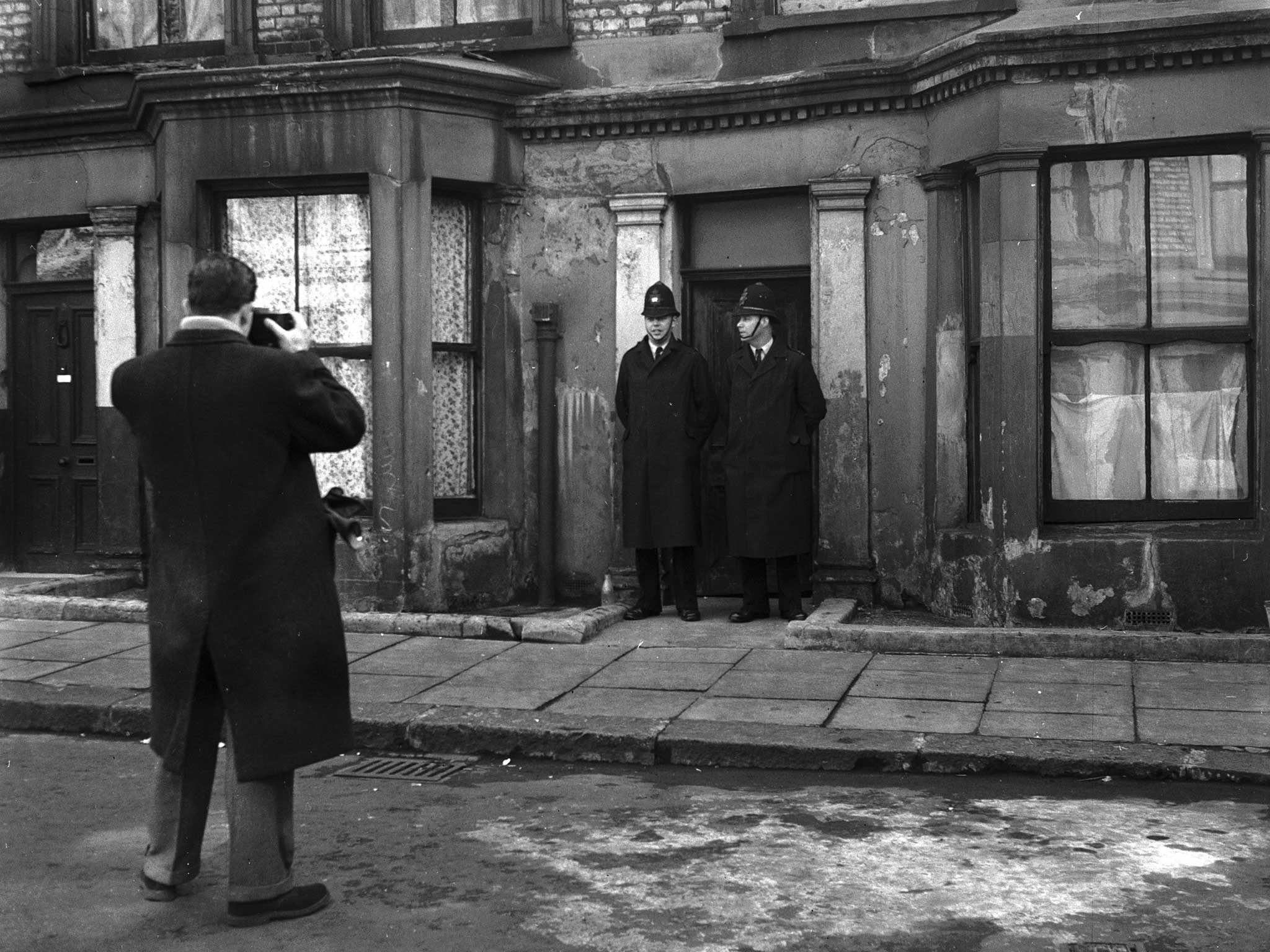 Police officers guarding the entrance to 10 Rillington Place in Notting Hill, London