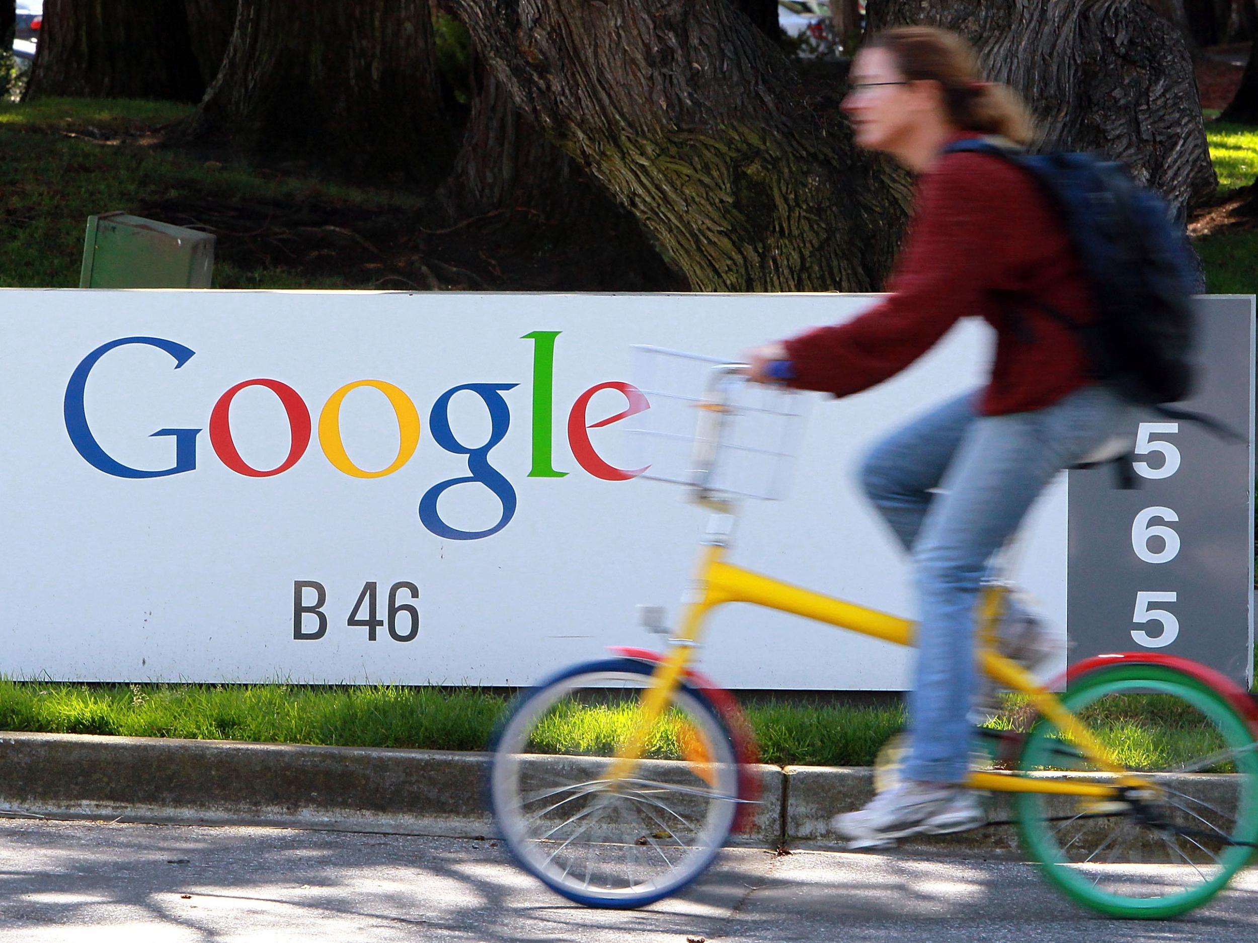 A Google employee rides through the company's headquarters in Mountain View, California in 2010
