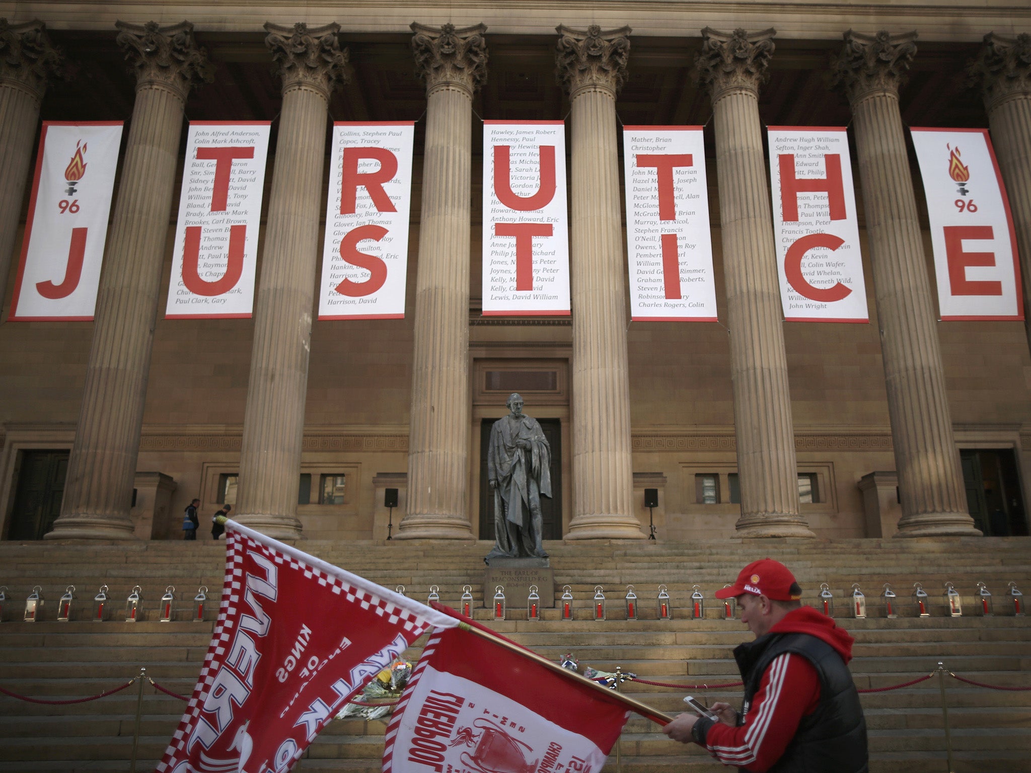 A banner hung from the Doric pillars of Saint George's Hall in the centre of Liverpool