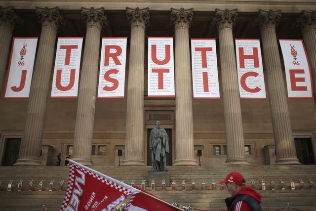 A banner hung from the Doric pillars of Saint George's Hall in the centre of Liverpool