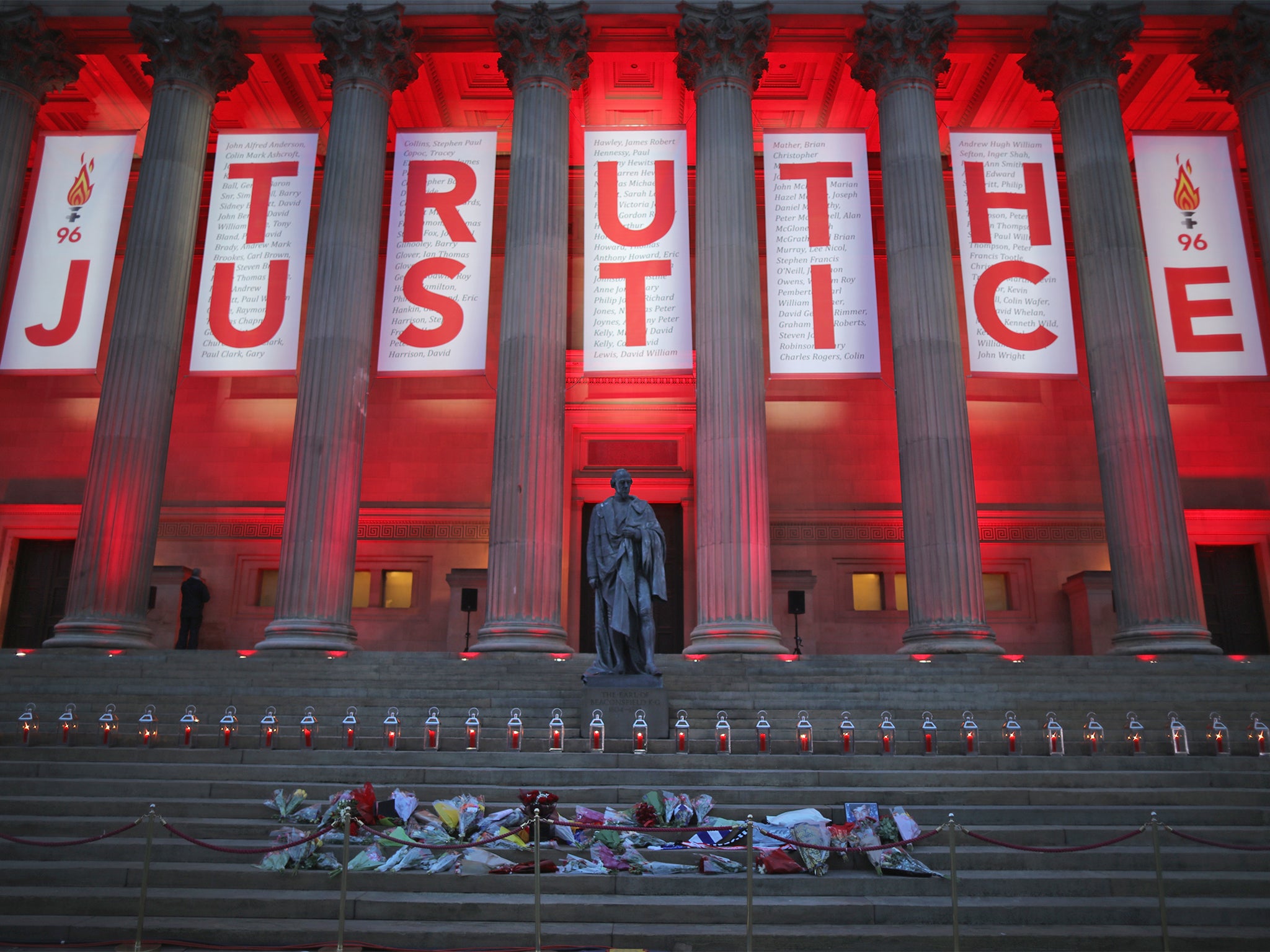 A banner reading 'Truth' and 'Justice' hangs from Liverpool's Saint George's Hall