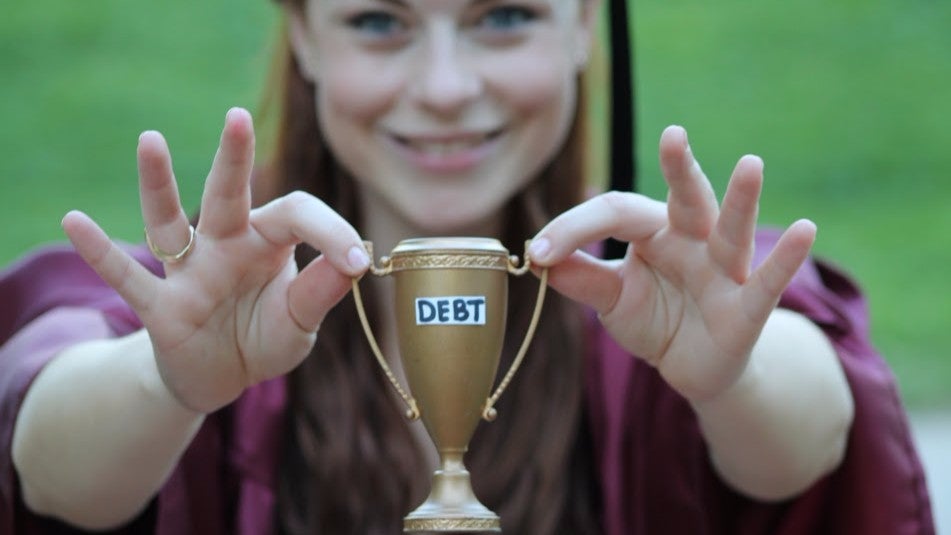 Maigan Kennedy, pictured, poses with her 'award' on graduation day
