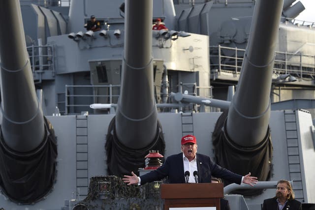 Donald Trump delivers a speech aboard a World War II battleship in September <em>Robyn Beck/Getty</em>