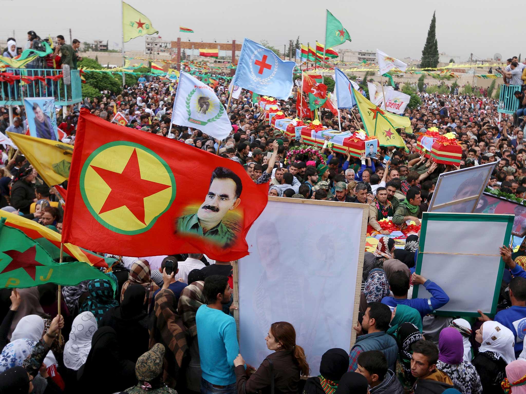 A funeral procession for Kurds killed in clashes with Syrian pro-government forces